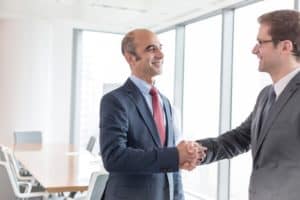 two businessmen shaking hands