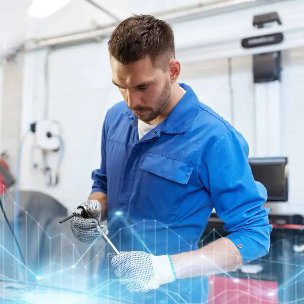 auto mechanic man with wrench and lamp working at workshop