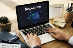 A person working on their laptop on inovation