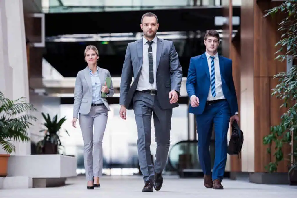 Three team leaders dressed in suits,business people group walking standing and top view